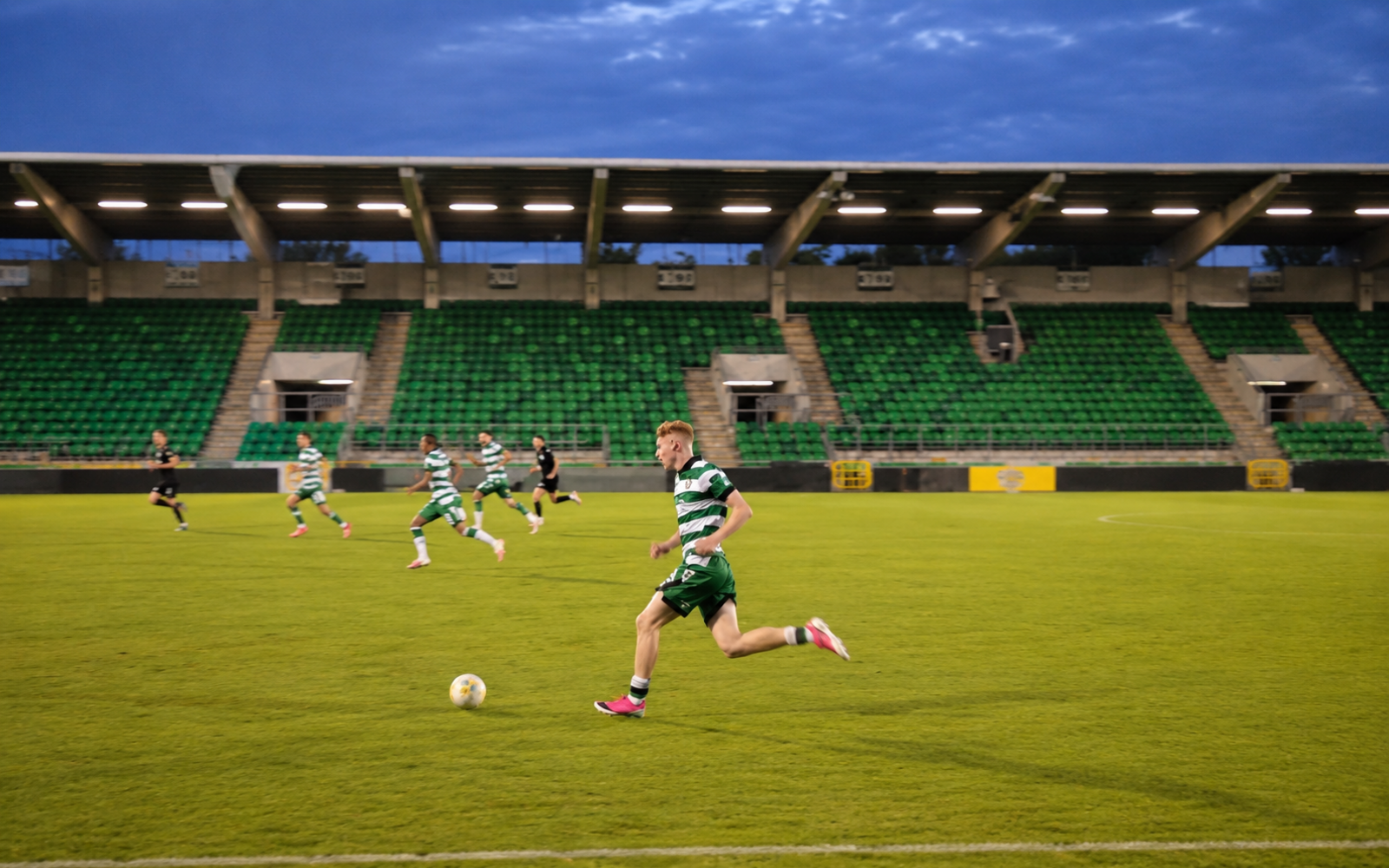 Adam Brennan carrying the ball forward during a Shamrock Rovers match